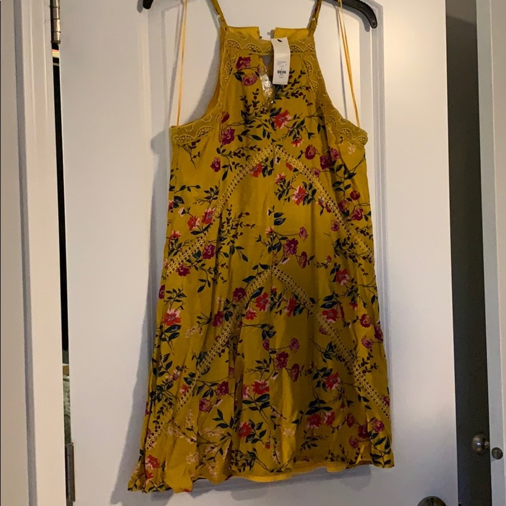 Yellow swing dress with floral design
